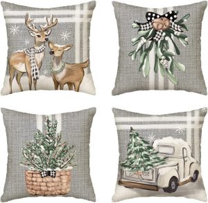 Urban Farmhouse decor ideas as throw pillows with grey, green, and white Christmas scenes on them