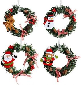 4 small wreaths with winter figures on the left side of each