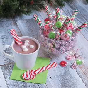 Candy cane spoons in hot chocolate with mini marshmallows to enjoy after your Above Cabinet Christmas Decorating Ideas are in place