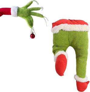 The lower body and an arm holding a tree ornament, both made to look like the grinch wearing a Santa suit as Grinch Christmas Display Ideas